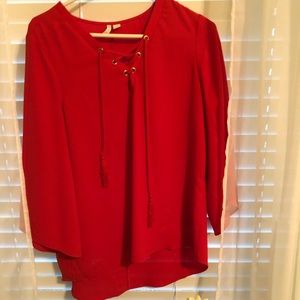 Red corseted blouse